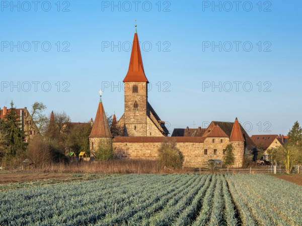 The medieval fortified church of St. George in the district of Kraftshof, Nuremberg, Middle Franconia, Bavaria, Germany