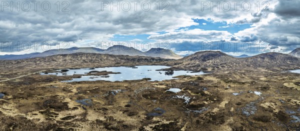 Panorama of Rannoch Moor from a drone over Loch Ba and Loch of the Armpit, A82 Highland Way, Argyll and Bute, West Highlands, Scotland, United Kingdom