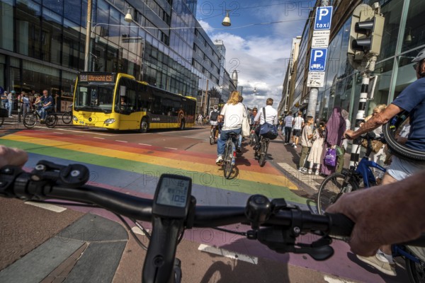 Ride your bike on the central cycle path on Lange Viestraat, Vredenburg, in the city centre of Utrecht, lanes for pedestrians, cyclists and public transport vehicles are separated, heavy cycle traffic, Netherlands
