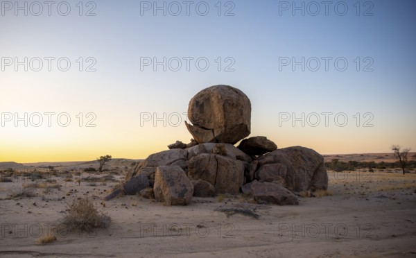 Round stacked rocks, desert landscape at sunset, Erongo, Damaraland, Namibia