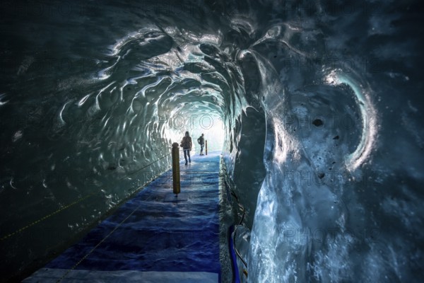 Artificial ice cave through the glacier ice, Mer de Glace, Montenvers, Chamonix, Haute-Savoie, France