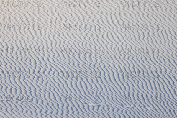 Wind creates wave patterns in the sand dunes at White Sands National Park in Alamogordo, New Mexico, USA
