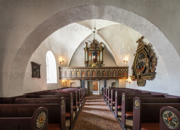 Pews and organ in Gothic interior with decorative details, 14th century church, Old Town, Ringkøbing, Ringkøbing Fjord, Denmark
