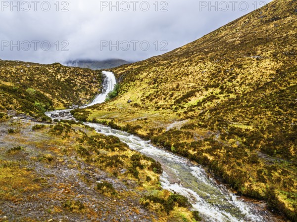 Eas a' Bhradain waterfall, Red Cuillin mountains, Loch Ainort, Isle of Skye, Scotland, UK