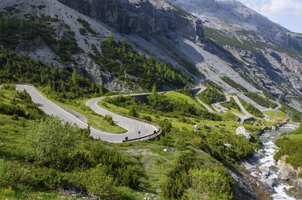 Bends from the south south-west descent of the ascent to the Stelvio Pass, on the right at the edge of the picture Torrente Braulio river, Valdidentro, Sondrio, Lombardy, Italy