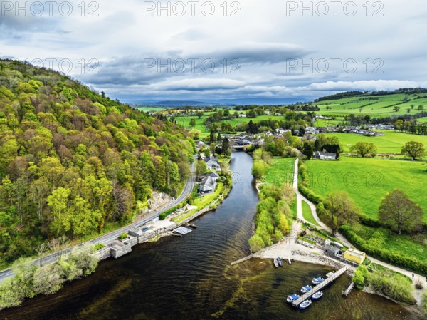 Farms and mountains over Ullswater Lake from drone, Pooley Bridge, Lake District National Park, Cumbria, England, United Kingdom