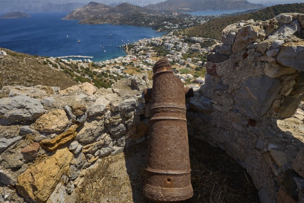 Old cannon on ruins overlooking the sea and surrounding landscape of hills, Pandeli Castle, Castle, Leros Fortress, St John's Fortress, Apitiki Hill, Pandeli Bay, Agia Marina, Leros, Dodecanese, Greek Islands, Greece