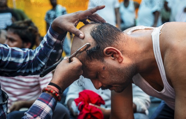 Drivers affiliated with Ola, Uber, and Rapido, under the banner of the Assam State Drivers' Union and the All Assam Cab Welfare Federation, shaved their heads in protest in Guwahati, India, on July 22, 2025. The demonstration held to highlight their demands for fair fare rates, regulation of aggregator commissions, and access to social security and welfare benefits