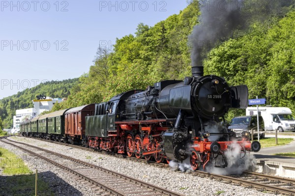 Steam train of the Sauschwänzlebahn steam railway railway steam locomotive at Weizen station, Germany
