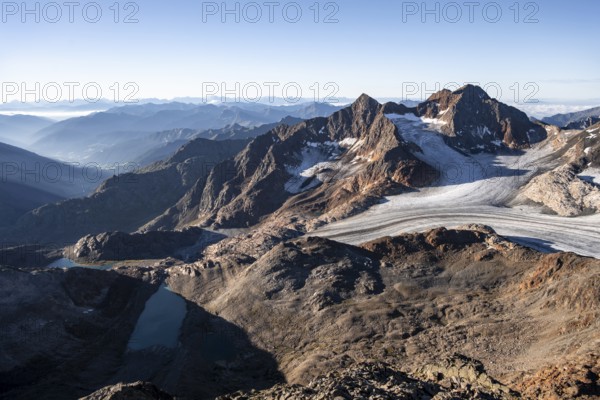 Picturesque high mountain landscape at sunrise, glacier and rocky mountain peaks in the morning light, view of the Königshofspitz mountain peak and Übeltalferner glacier at Becher, Stubai Alps, South Tyrol, Italy