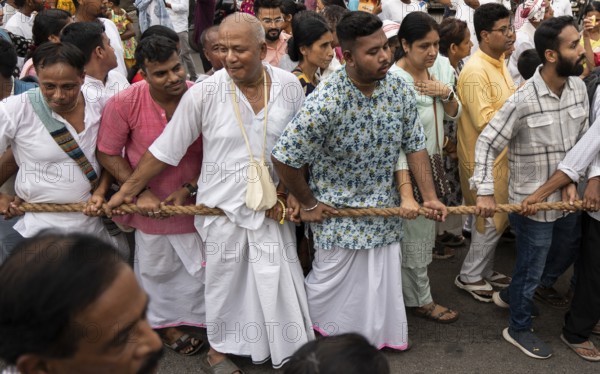Hindu devotees takes part in Rath Yatra religious procession Guwahati, India on June 27, 2025. Rath Yatra, also known as the Chariot Festival, is a major Hindu festival celebrated in India