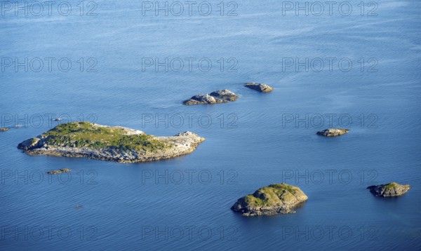 Small rocky islands in the sea, archipelago islands, near Henningsvær, Vågan, Lofoten, Nordland, Norway