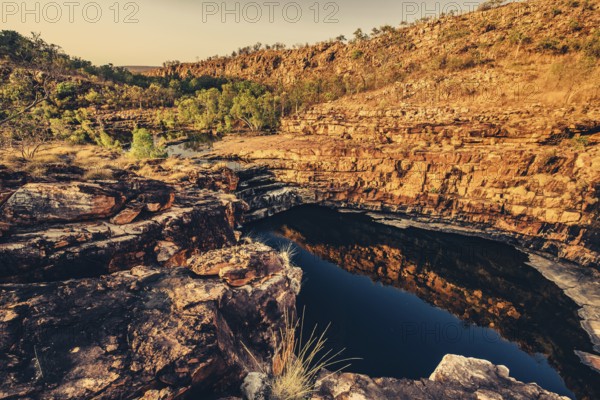 Bell Gorge waterfall, a body of water in north-west Australia in the Kimberley. Sunrise in the outback, Australia