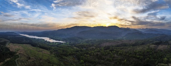 Panorama of Sunset over Mountains and Coniston Water from drone, Lake District National Park, Cumbria, England, United Kingdom