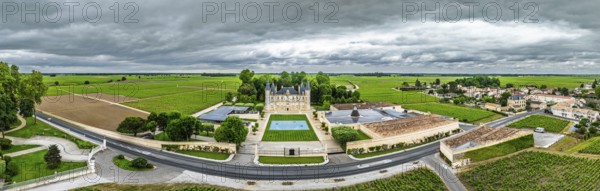 Panorama of Chateau Pichon Longueville Baron Vineyard and grape fields around Pauillac from a drone, Bordeaux, Gironde, Nouvelle-Aquitaine, France