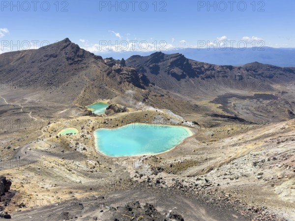 On the hiking trail of the Tongariro Alpine Crossing in Tongariro National Park with a view of the Emerald Lakes, North Island, New Zealand, Oceania