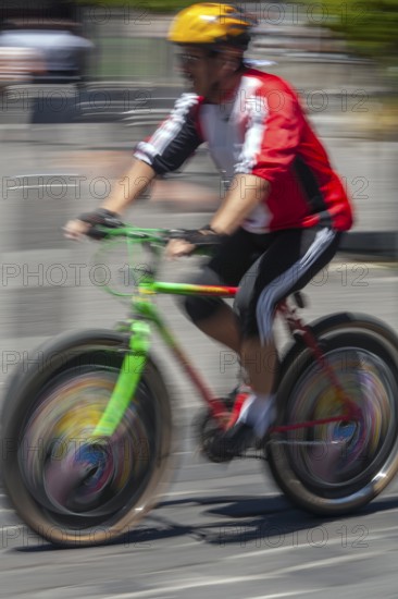 Man riding a bicycle, Photo with motion blur, City of Quito, Pichincha province, Ecuador, South America