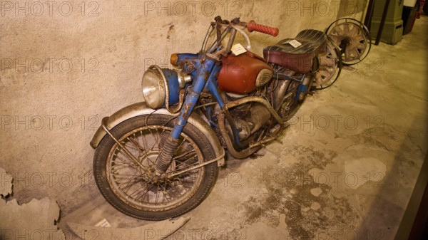 An old, dusty motorbike on display in a bunker, War Museum, Military Museum, Tunnel Museum, Lakki, Leros, WW2, Dodecanese, Greek Islands, Greece
