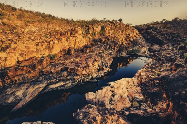 Bell Gorge waterfall, a body of water in north-west Australia in the Kimberley. Sunrise in the outback, Australia