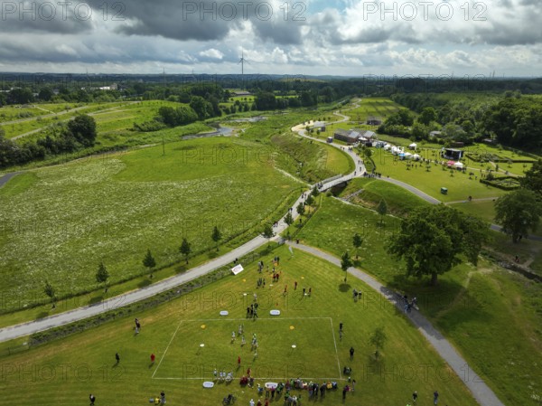 Recklinghausen, Castrop-Rauxel, Ruhr area, North Rhine-Westphalia, Germany - Sports festival in the EMSCHERLAND adventure park, a new nature and water adventure park on the renaturalised Emscher, at the water cross of the Emscher with the Rhine-Herne Canal on the city boundary of Recklinghausen and Castrop-Rauxel. Flood protection by expanding the area. The ecological focus at the confluence of the Suderwicher Bach and Emscher will also become a future garden for the International Garden Exhibition IGA 2027. Before the renaturalisation, the Emscher river system was an open, above-ground wastewater channel, combined sewer with surface water and wastewater