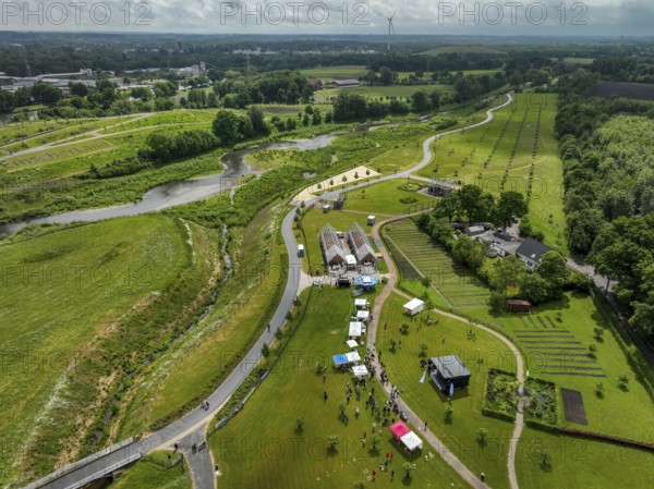 Recklinghausen, Castrop-Rauxel, Ruhr area, North Rhine-Westphalia, Germany - Sports festival in the EMSCHERLAND adventure park, a new nature and water adventure park on the renaturalised Emscher, at the water cross of the Emscher with the Rhine-Herne Canal on the city boundary of Recklinghausen and Castrop-Rauxel. Flood protection by expanding the area. The ecological focus at the confluence of the Suderwicher Bach and Emscher will also become a future garden for the International Garden Exhibition IGA 2027. Before the renaturalisation, the Emscher river system was an open, above-ground wastewater channel, combined sewer with surface water and wastewater