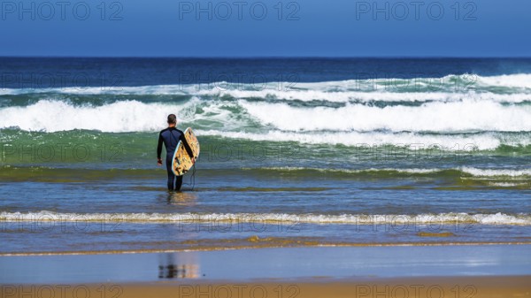 Surfer on Contis beach, Saint Julien en Born, Saint-Julien-en-Born, Landes, France