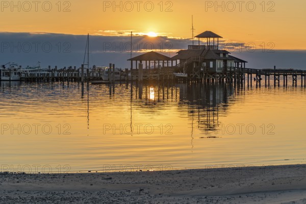 Biloxi Schooner Pier Complex at sunset on the Gulf of Mexico at Biloxi, Mississippi, USA