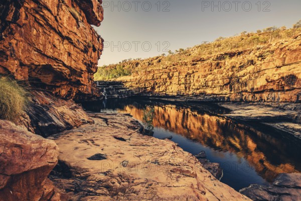 Bell Gorge waterfall, a body of water in north-west Australia in the Kimberley. Sunrise in the outback, Australia