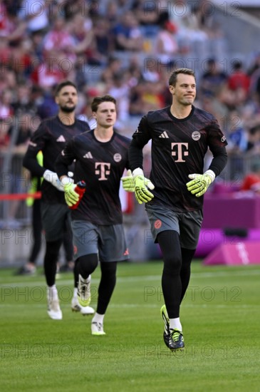 Three FC Bayern FCB goalkeepers Goalkeeper Manuel Neuer FC Bayern Munich FCB (01) Goalkeeper Sven Ulreich FC Bayern Munich FCB (26) Goalkeeper Jonas Urbig FC Bayern Munich FCB (40) Warm-up training Telekom Cup Allianz Arena, Munich, Bavaria, Germany