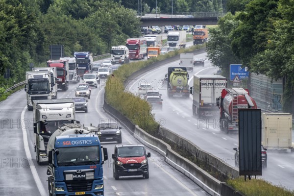 Heavy traffic, mainly lorries, on the A40 motorway near Rheurdt, at the Neufelder Heide rest area, a few kilometres in front of the border with the Netherlands, rainy weather, North Rhine-Westphalia, Germany