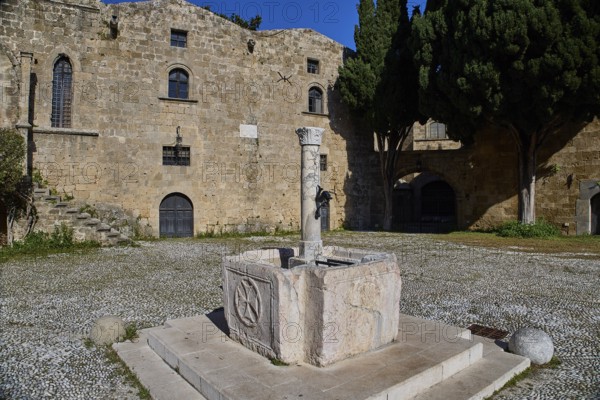 Fountain, Agyrokastrou, Former castle courtyard with fountain and central Tor tor, characterised by stones, Rhodes Old Town, Rhodes, Dodecanese, Greek Islands, Greece