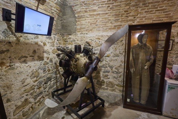 Exhibition with a large propeller engine next to a pilot's suit, War Museum, Military Museum, Tunnel Museum, Lakki, Leros, WW2, Dodecanese, Greek Islands, Greece
