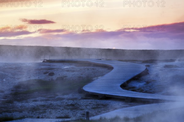 Curved wooden path, sulphur vapour, Hveravellir geothermal area, evening sky, Icelandic highlands, Suðurland, Sudurland, Iceland