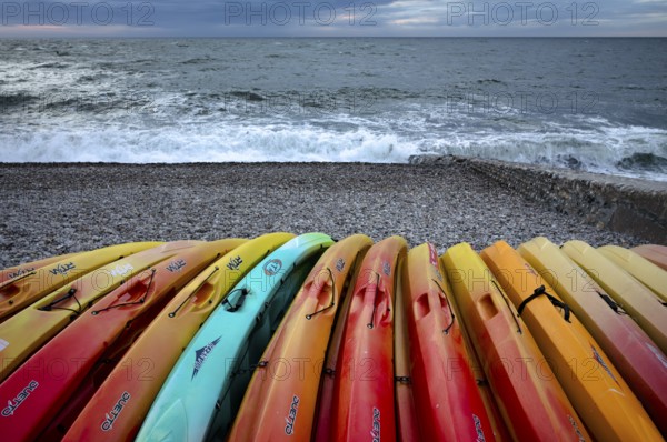 Kayaks, boats, colourful, lying on the beach, pebble beach, Étretat, sea, Normandy, Seine-Maritime, France