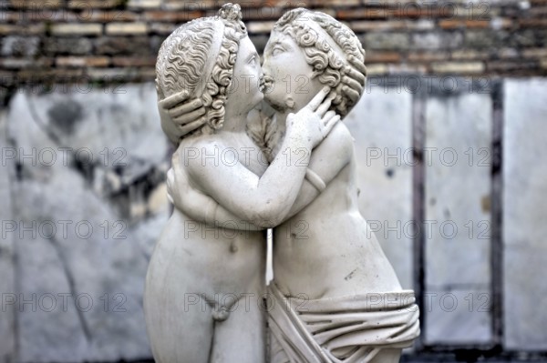 Statue of Love and Psyche, man and woman kissing, naked couple, stone carving in marble, excavation site Archaeological Park Ostia Antica, Metropolitan City of Rome, Lazio, Italy