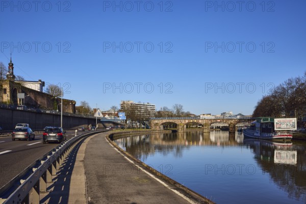 River Saar, footpath and cycle path, riverbank, general architecture, reflections on the water surface, blue sky, cloudless, motorway A620, Old Bridge, Saarbrücken, state capital, regional association Saarbrücken, Saarland, Germany