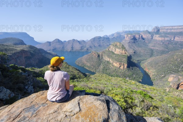 Hiker enjoying panorama, Blyde River Canyon with summit Three Rondawels, view of canyon with river Blyde River and table mountains, canyon landscape, Panorama Route, Mpumalanga, South Africa