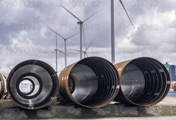 The seaport of Eemshaven, Julianahaven Basin, where the foundation structures, monopiles, for offshore wind farms are stored, which then support the actual wind turbines, the components are transported to the wind farms in the North Sea on large workboats and anchored to the seabed, where the wind turbines are then built, Eemshaven, Netherlands