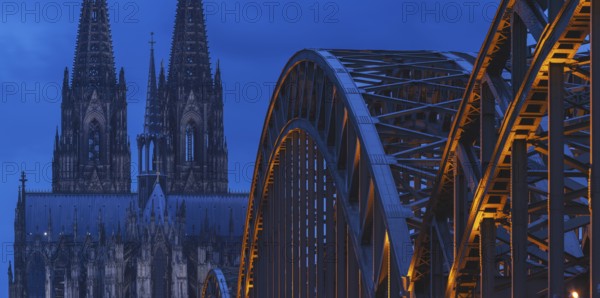 Cologne Cathedral and the Hohenzollern Bridge illuminated with LED lights, Cologne, North Rhine-Westphalia, Germany