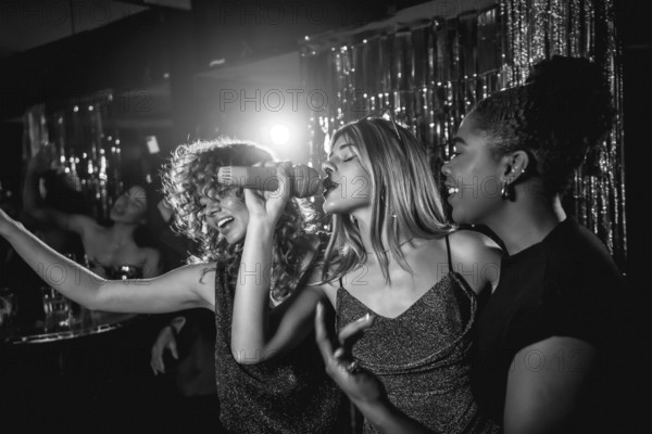 Group of friends singing joyfully during karaoke night, enjoying each other's company and creating unforgettable memories in a lively nightclub