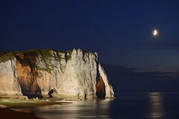 Cliffs with the Falaise d'Aval rock gate and the Aiguille rock needle at night, Etretat, Alabaster Coast, Seine-Maritime, Normandy, France