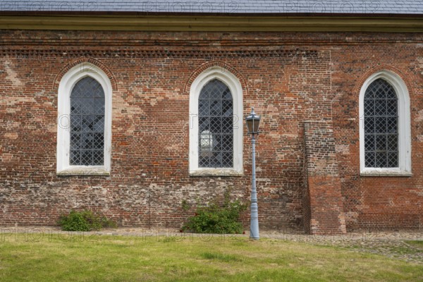 Brick façade with window, St Laurentius Church, town church, market, old town, Tönning, North Frisia, Schleswig-Holstein, Germany