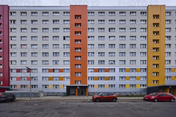 High-rise buildings, residential buildings, residential silos, facade, window, car park with vehicles, lantern, diffuse light, cloudy, Pablo-Neruda-Straße, Magdeburg, state capital, independent city, Saxony-Anhalt, Germany