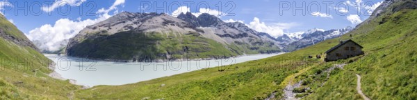 Panorama, blue mountain lake and alpine hut in mountain landscape, Lac des Dix reservoir and Mont Blanc de Cheilon peak, Valais Alps, Valais, Switzerland