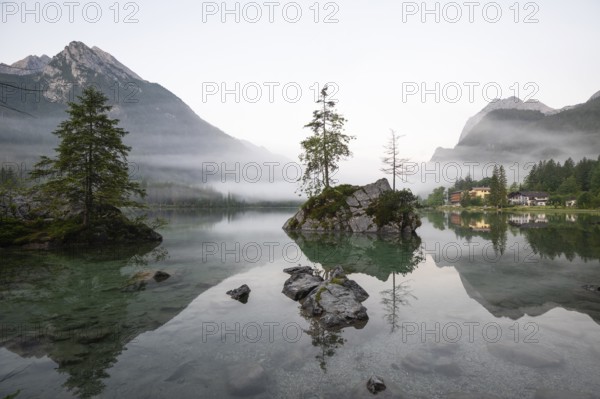 Magical sunrise with fog at Hintersee near Ramsau in Berchtesgadener Land
