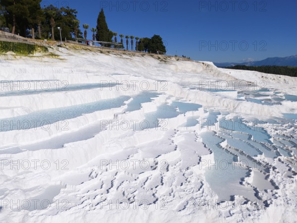Cascading white terraces with turquoise water against a blue sky, aerial view, sinter terraces, limestone sinter terraces, travertine terraces, Pamukkale, Denizli, UNESCO World Heritage Site, Anatolia, Turkey