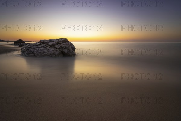 The sun rises on the Costa Rei, a stretch of coastline on the Italian Mediterranean island of Sardinia, Monte Nai, Costa Rei, Sardinia, Italy