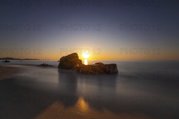 The sun rises on the Costa Rei, a stretch of coastline on the Italian Mediterranean island of Sardinia, Monte Nai, Costa Rei, Sardinia, Italy