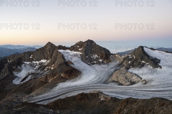 High mountain landscape at sunrise, glacier and rocky mountain peaks, view of the Königshofspitz mountain peak and Übeltalferner glacier, Stubai Alps, South Tyrol, Italy