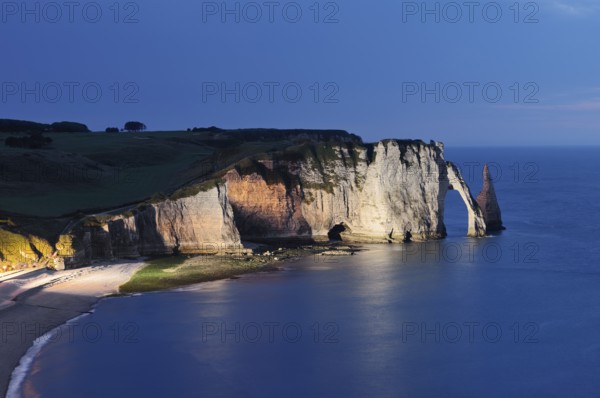 Cliffs with the Falaise d'Aval rock gate and the Aiguille d'Etretat rock needle at night, Etretat, Alabaster Coast, Seine-Maritime, Normandy, France